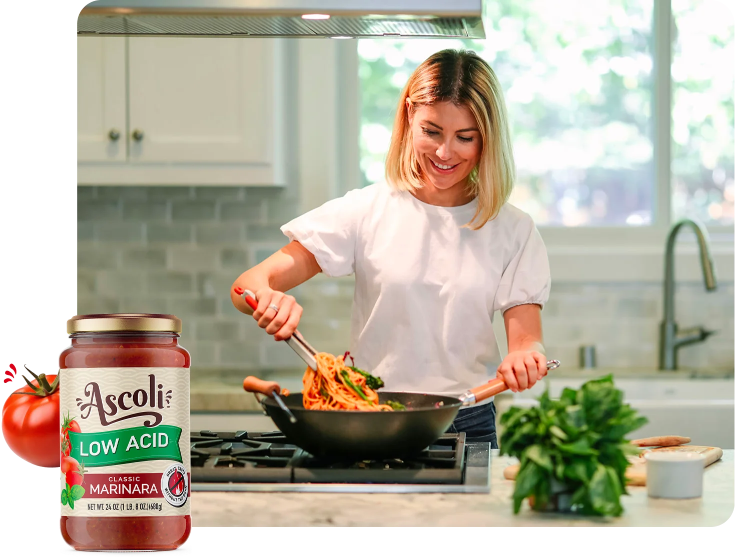 Woman happily cooking spaghetti using Ascoli low acid classic marinara pasta sauce